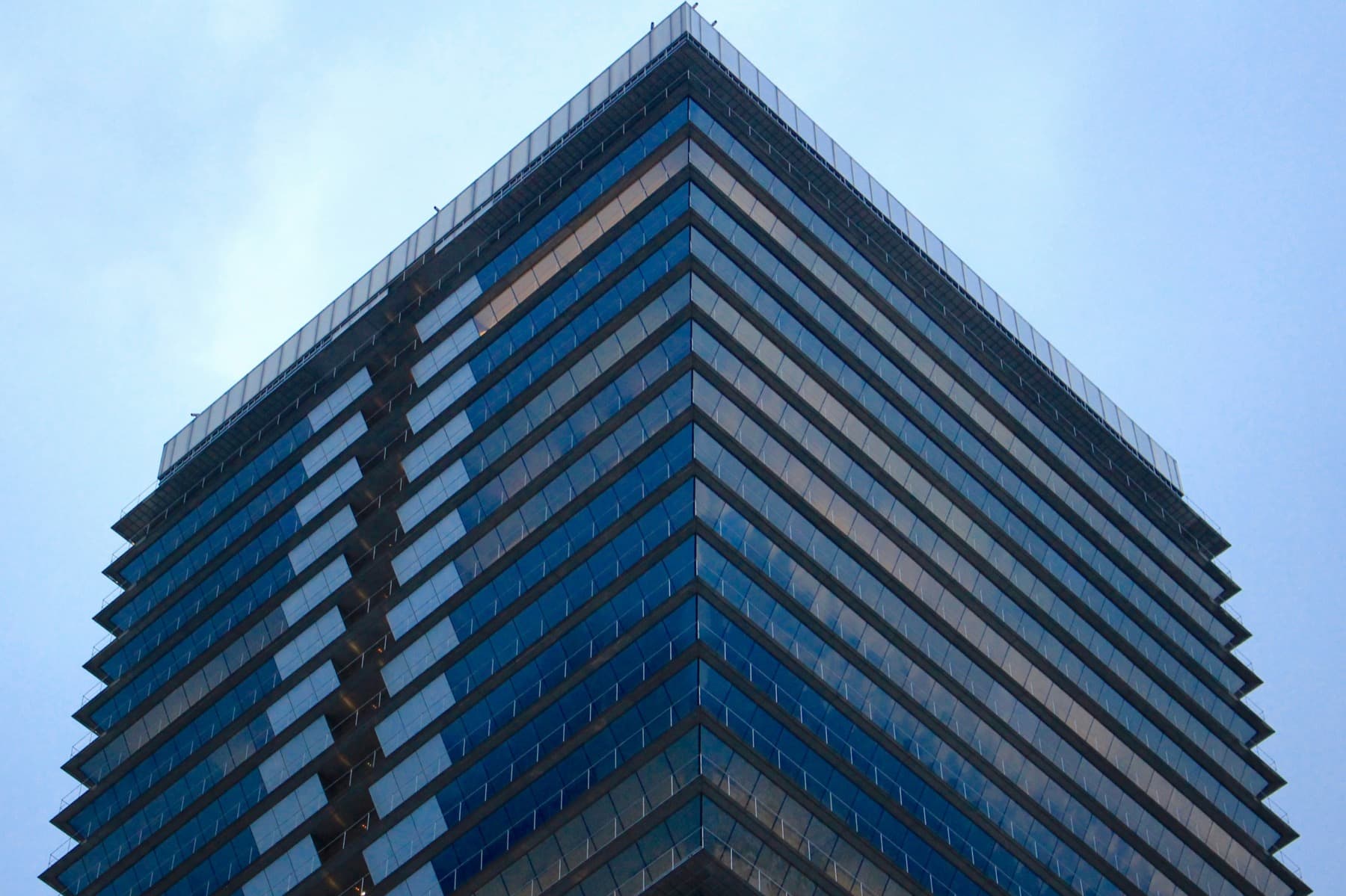 Mapfre building in Barcelona reflecting light across its glass facade